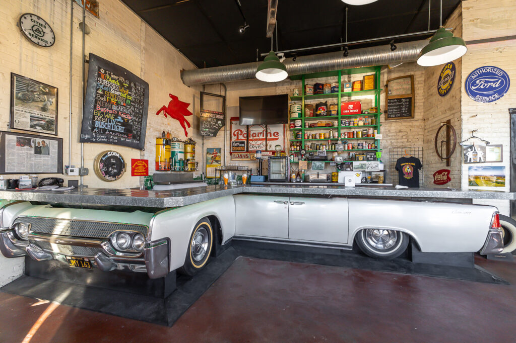 Interior photo of City Service Brewing in Darlington, WI. Restored 1962 Lincoln Continental turned into a bar. Property listed for sale by Carson Crist of Crist Real Estate Group.